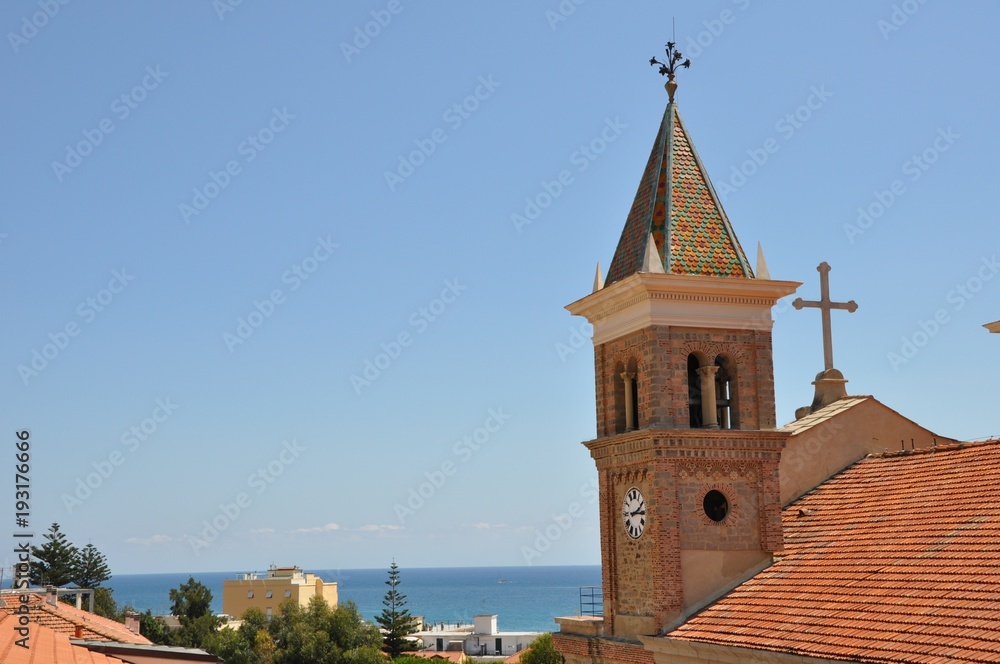View of the church in Italy Liguria in summer, there is a place for a signature