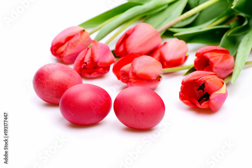 Bunch of flowers near Easter eggs. Bouquet of spring tulips