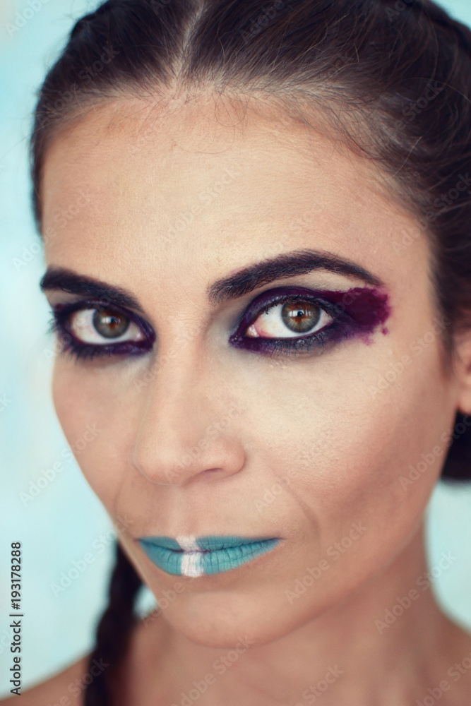 Portrait of the girl with creative art makeup with bright colors Portrait of the girl with creative art makeup with bright colors