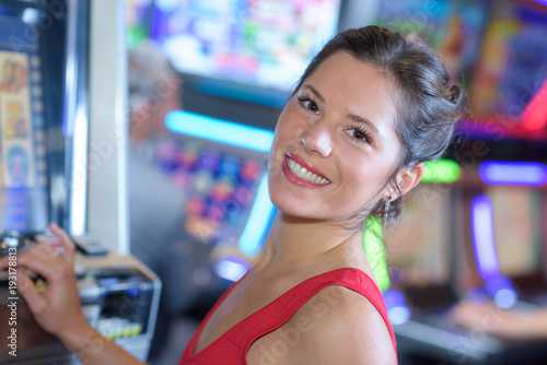 Photography happy girl playing slot machines in las vegas