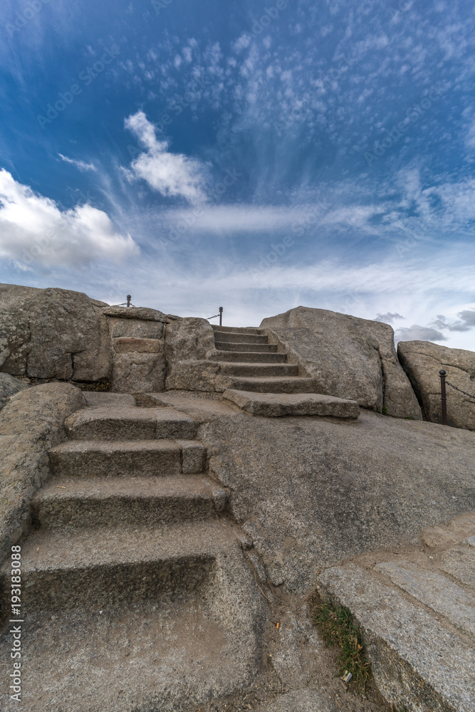 Celtic Vetton sacred space (Nemeton) Altar of sacrifices sculpted in granite rock known as Silla de Felipe II (Phillip II chair) in Guadarrama Mountains near San Lorenzo del Escorial, Madrid, Spain Celtic Vetton sacred space (Nemeton) Altar of sacrifices sculpted in granite rock known as Silla de Felipe II (Phillip II chair) in Guadarrama Mountains near San Lorenzo del Escorial, Madrid, Spain