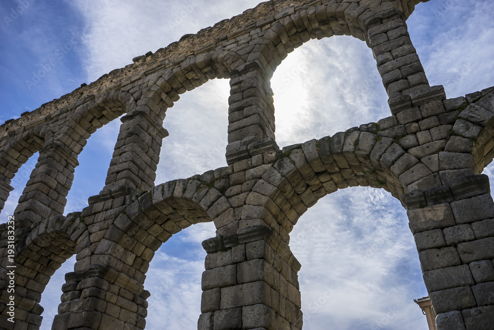 Tourist, Roman aqueduct of segovia. architectural monument declared patrimony of humanity and international interest by UNESCO. Spain Tourist, Roman aqueduct of segovia. architectural monument declared patrimony of humanity and international interest by UNESCO. Spain