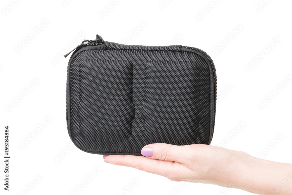 Naklejka premium Close up view of woman hand holding black case for batteries for quadcopter