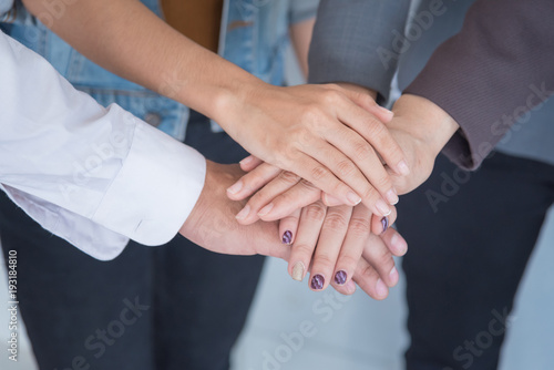 business team put hand together   collaboration and teamwork concept