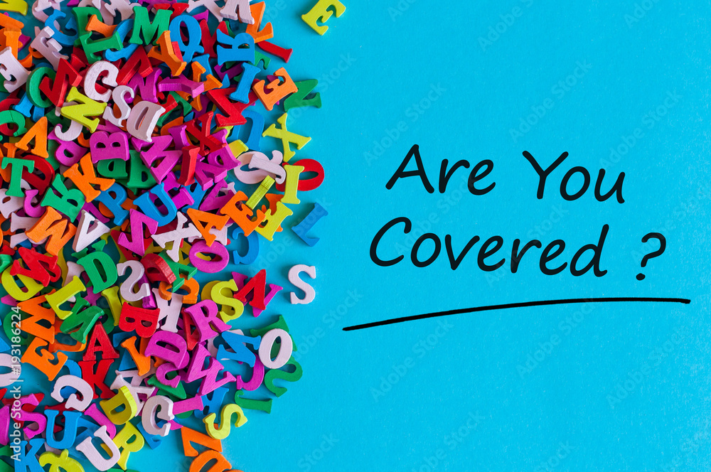 Many little alphabets letters and inscription - Are you covered. Insurance concept