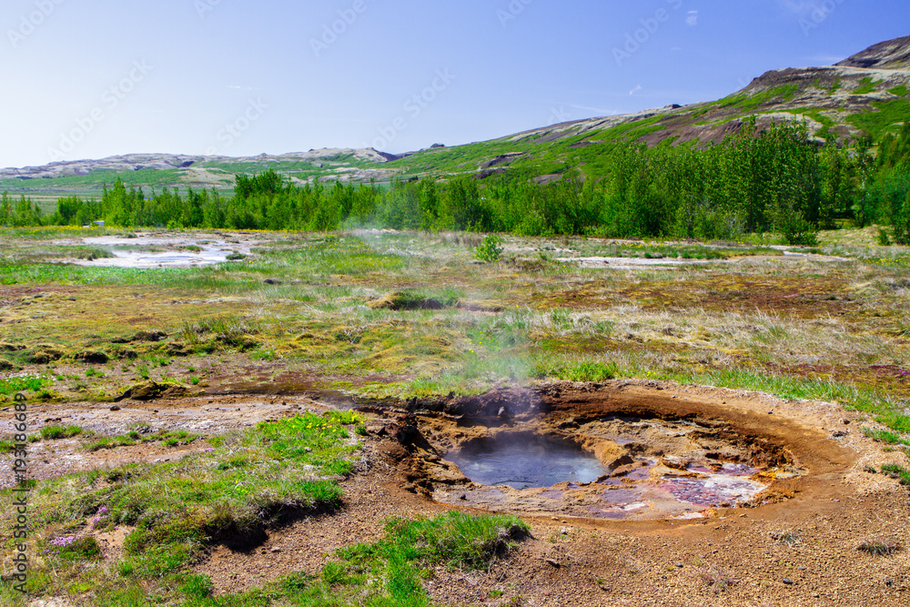 Geyser in the period of calm near the volcano, the Golden Ring in Iceland Geyser in the period of calm near the volcano, the Golden Ring in Iceland