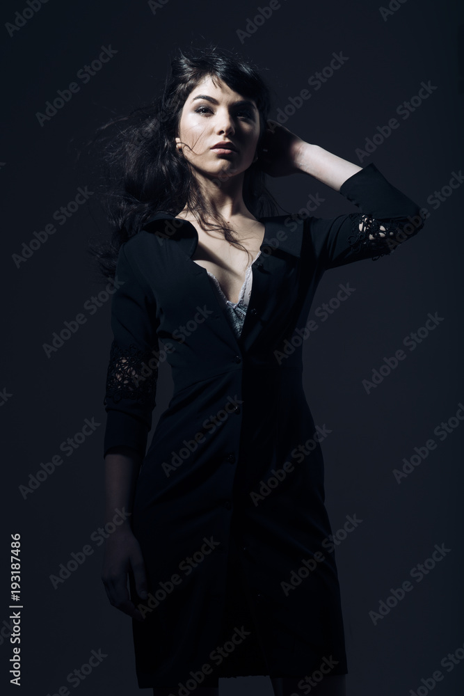 Girl with sensual face and beautiful breasts in dark room. Girl with sensual face and beautiful breasts in dark room.