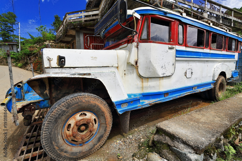 Filipino white-blue dyipni-jeepney stationed beside south road. Sagada town-Mountain province-Philippines. 0224