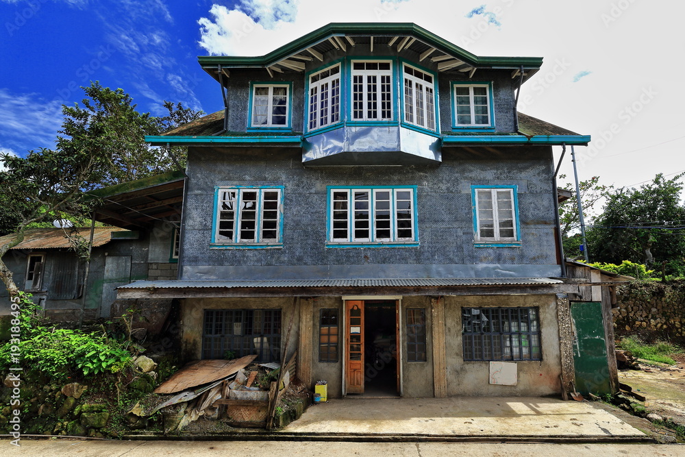 Filipino vernacular architecture-grey house beside the S.Road. Sagada town-Mountain province-Philippines. 0226