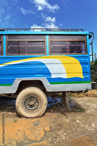 Filipino white-yellow-blue dyipni-jeepney stationed beside south road. Sagada town-Mountain province-Philippines. 0225 photo