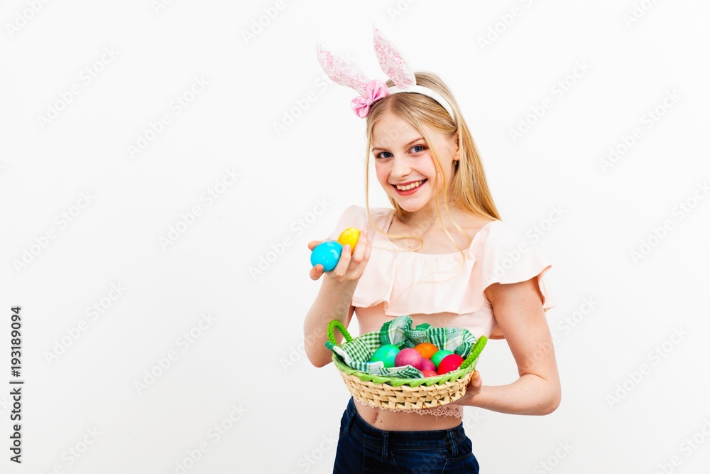 Teenage girl holding Easter eggs Teenage girl holding Easter eggs