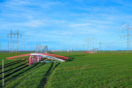 Unused transmissions or power towers taken down near nuclear power plant due to deactivation of the two reactors in 2008 at the V1 plant in Bohunice Nuclear Power Plant.  Fallen electricity pylons. photo