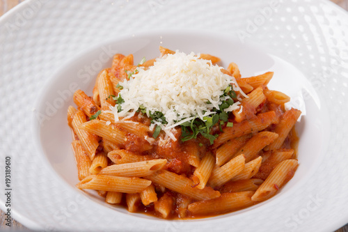 pasta penne with parmesan cheese tomato sauce greens