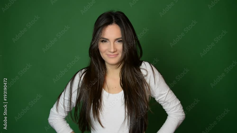 beautiful attractive Caucasian girl smiling isolated on green background beautiful attractive Caucasian girl smiling isolated on green background
