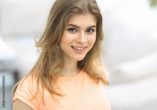Free Download closeup portrait of a young woman on blurred background. - GFXLoad