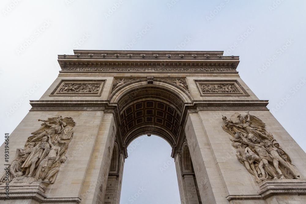  Arc de Triomphe (Triumph Arch) on place de l'Etoile in Paris, taken from below. It is one of the most famous monuments in Paris, standing on Champs Elysees on  center of Place Charles de Gaulle..