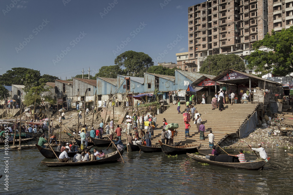 Dhaka / Bangladesh - November 2012: People are working in port of Dhaka during rush hours.