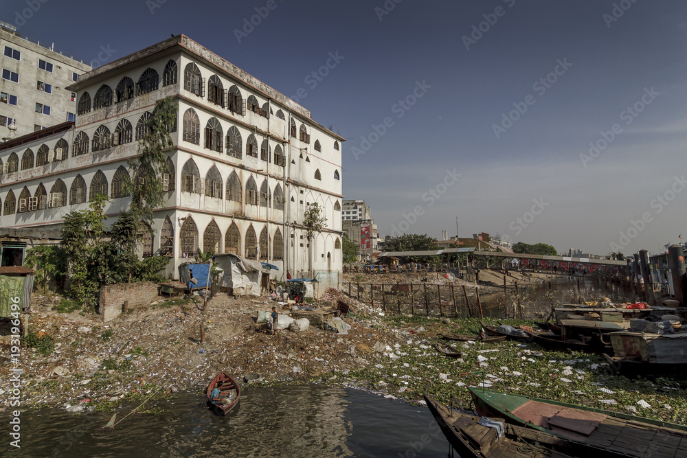 Dhaka / Bangladesh - November 2012: People are working in port of Dhaka during rush hours.