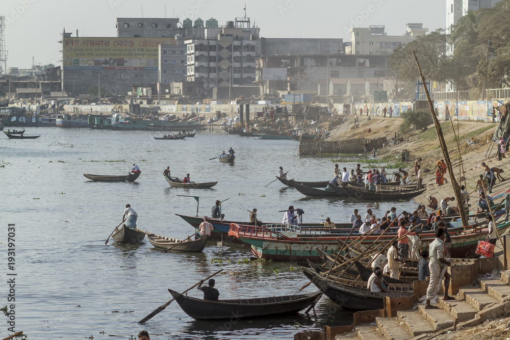 Dhaka / Bangladesh - November 2012: People are working in port of Dhaka during rush hours.