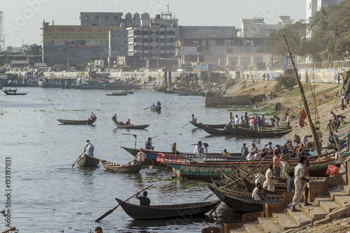 Dhaka / Bangladesh - November 2012: People are working in port of Dhaka during rush hours.