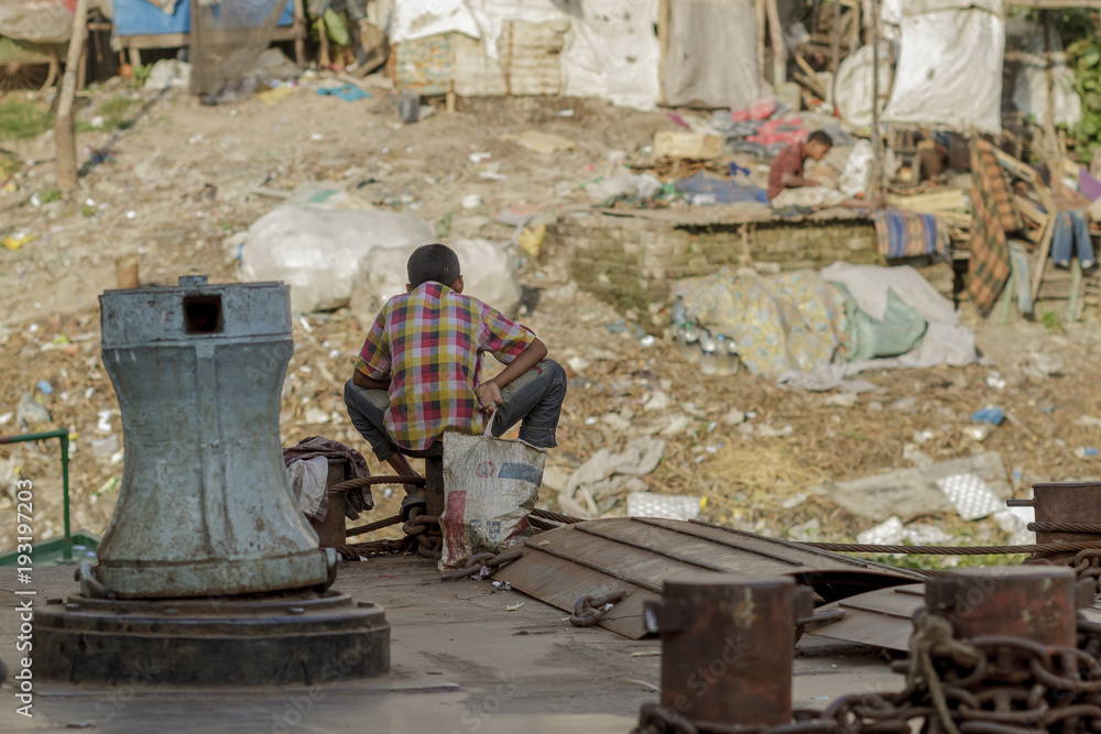 Dhaka / Bangladesh - November 2012: People are working in port of Dhaka during rush hours.
