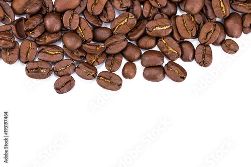 Closeup of coffee beans on white background. Copy space