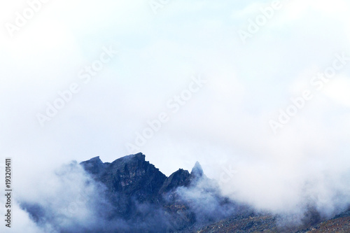 black stone rock and clouds © drakuliren