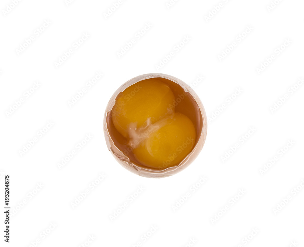 egg and two yolks on isolated white background