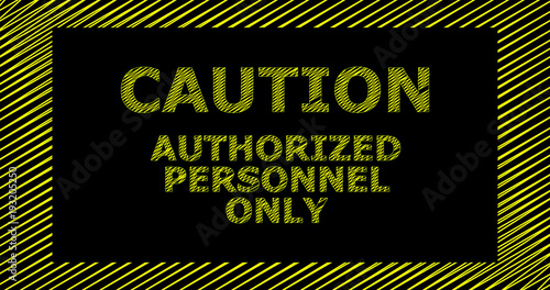 Caution authorized personel only sign; yellow letters on a black background.