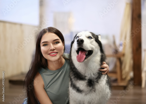 Young woman with cute Husky...
