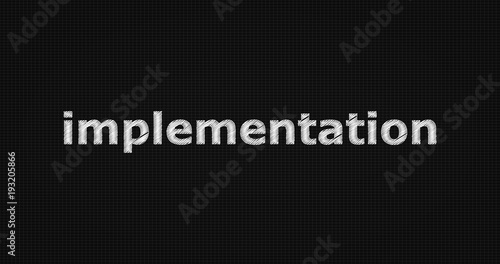 Implementation word on black background.
