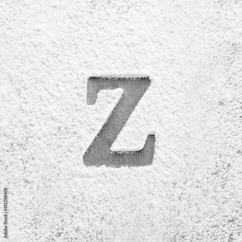 Silhouette of letter Z on scattered flour