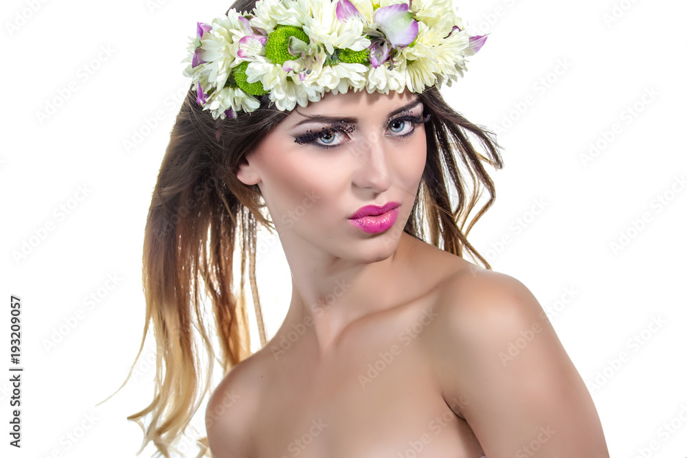 Beautiful woman in wreath of flowers