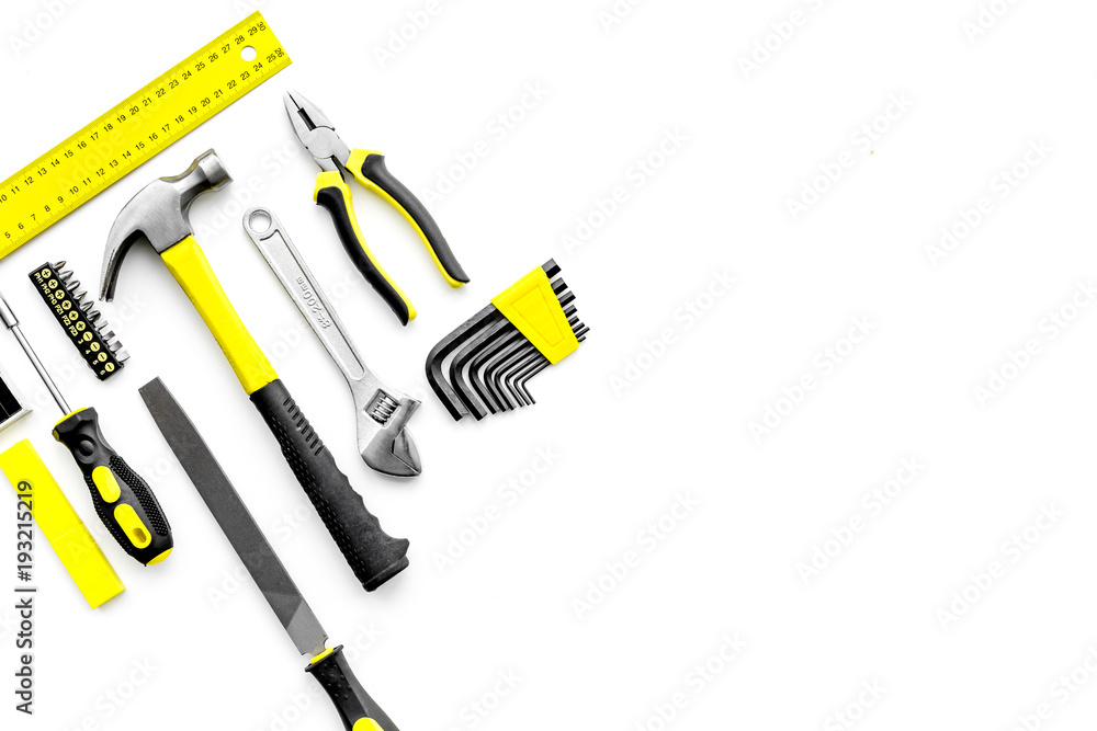 Various repair tools. Must-have for men. Equipment for building. White background top view copy space pattern Various repair tools. Must-have for men. Equipment for building. White background top view copy space pattern