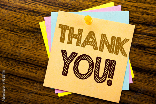 Conceptual hand writing text caption inspiration showing Thank You. Business concept for Thanks Message written on sticky note paper on the wooden background.
