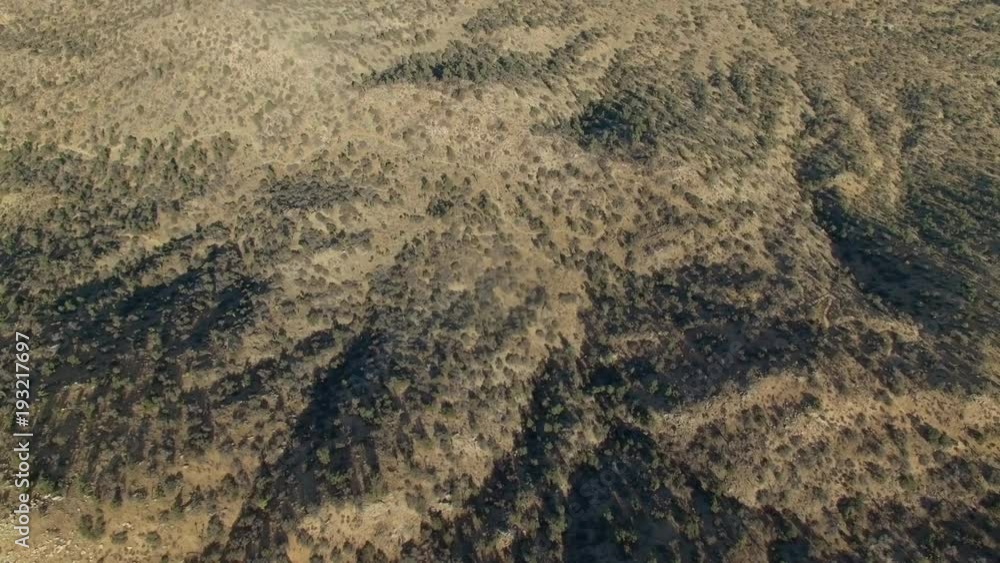High altitude drone shot with a slow tilt revealing the desert and dry mountains in Death Valley High altitude drone shot with a slow tilt revealing the desert and dry mountains in Death Valley