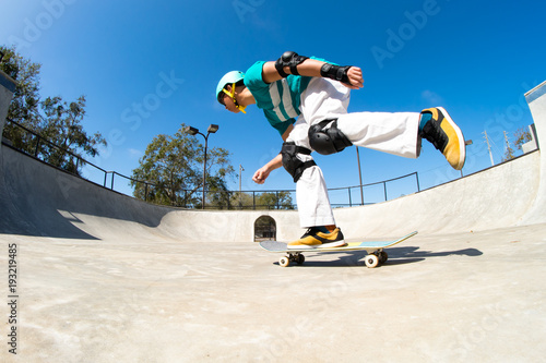Fototapeta Young skateboarder at a skatepark