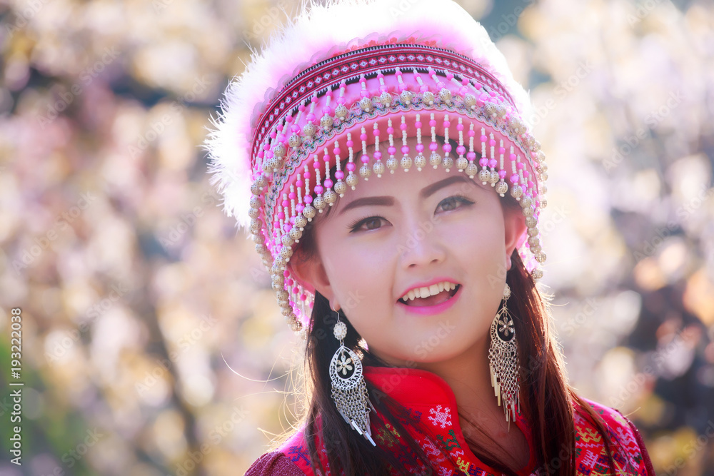 Mhong girl in traditional dress at wild himalayan cherry garden. Doi in thanon, Chiang Mai, Thailand Mhong girl in traditional dress at wild himalayan cherry garden. Doi in thanon, Chiang Mai, Thailand
