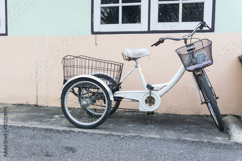 bicycle three wheels parking at home., disable concept.