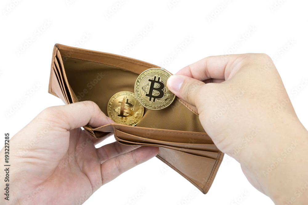 Fototapeta premium Bitcoin. Man hand holding gold bitcoin and brown wallet on isolated background