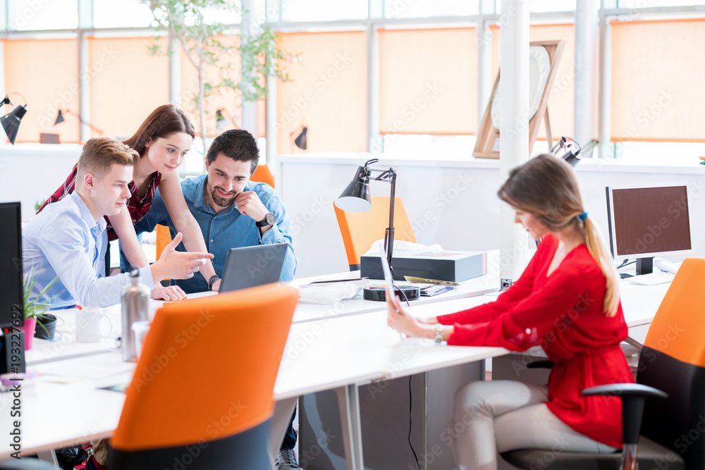 startup business, young creative people group brainstorming on meeting at office interior and using laptop and tablet computer to note ideas plans and projects