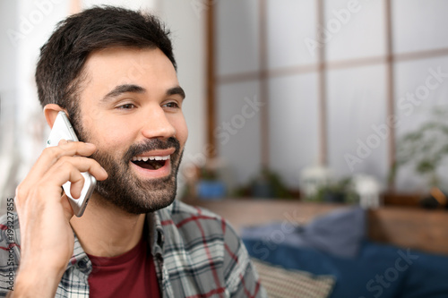 Young man talking on mobile...