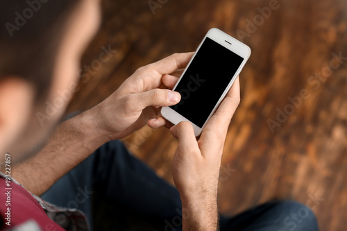 Man using mobile phone indo...