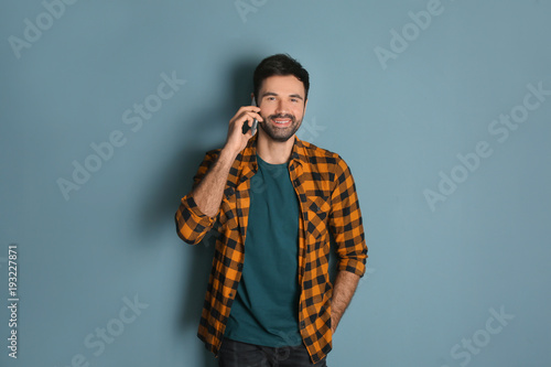 Young man talking on mobile...