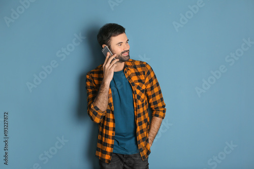 Young man talking on mobile...