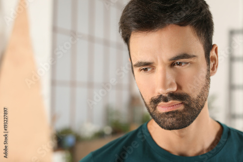 Young bearded man in casual...