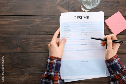 Woman filling in resume for...