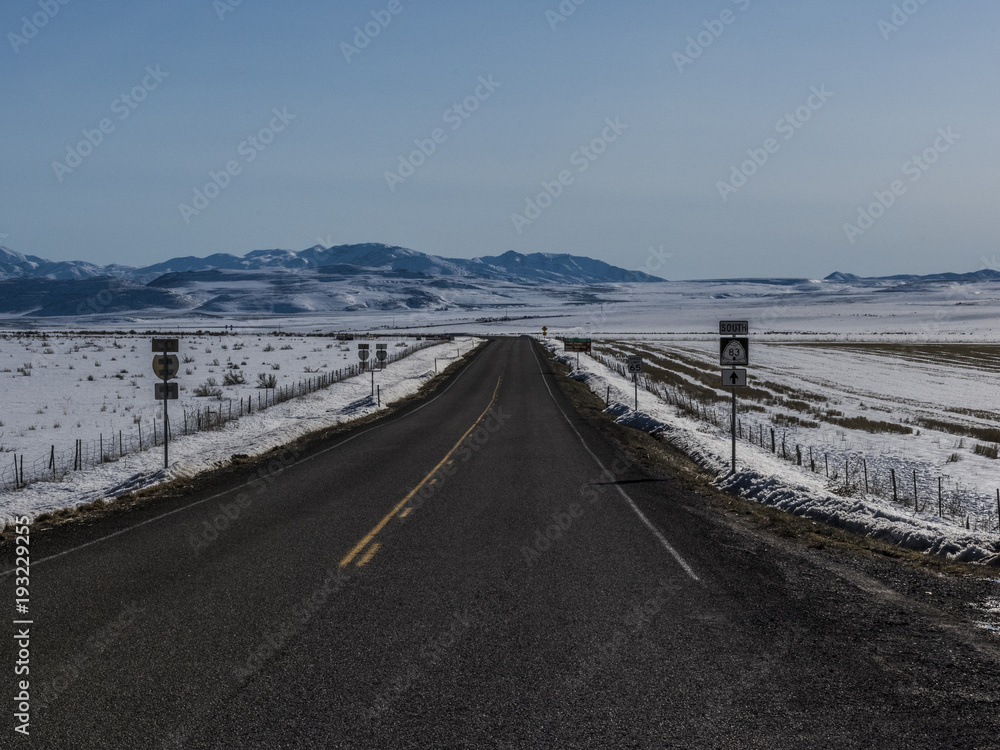 Highway through Snowy Landscape