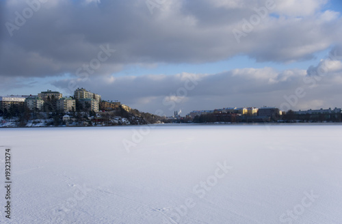 Fototapeta Naklejka Na Ścianę i Meble -  A snowy, cold and sunny view of the island Kungsholmen in Stockholm