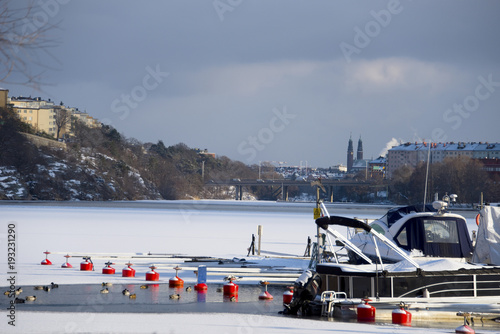 A snowy, cold and sunny view of the islands Kungsholmen and Essingen in Stockholm